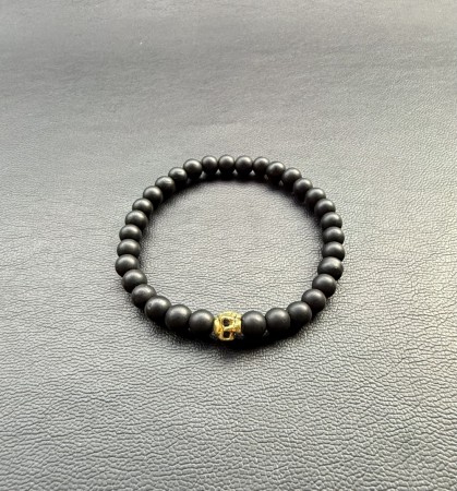 Black obsedian and golden skull.